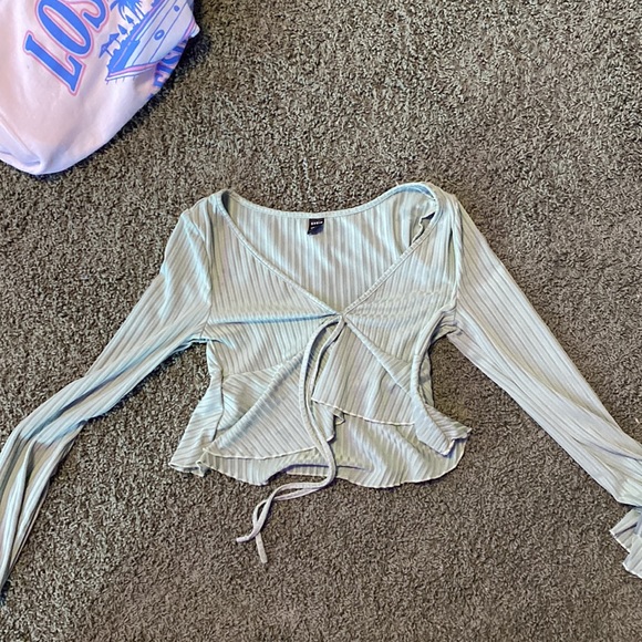 A bluish gray shirt and it’s a long sleeve + a super cute green ruffel top! - Picture 2 of 2